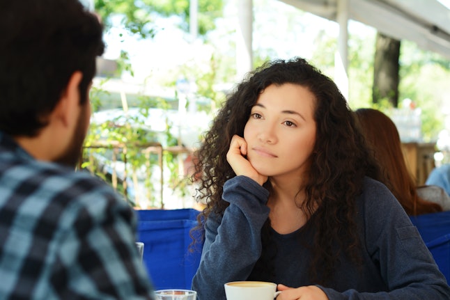 Young beautiful woman bored at a date in coffee shop.