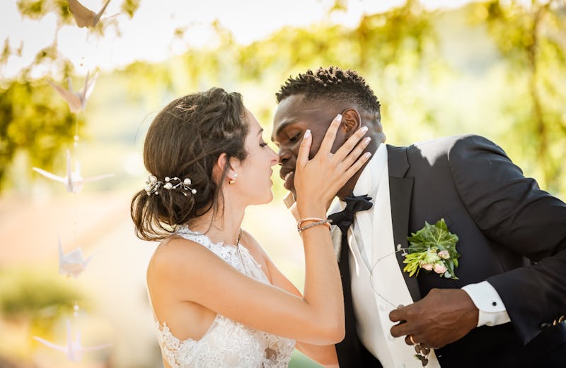 beautiful mixed couple of newlyweds