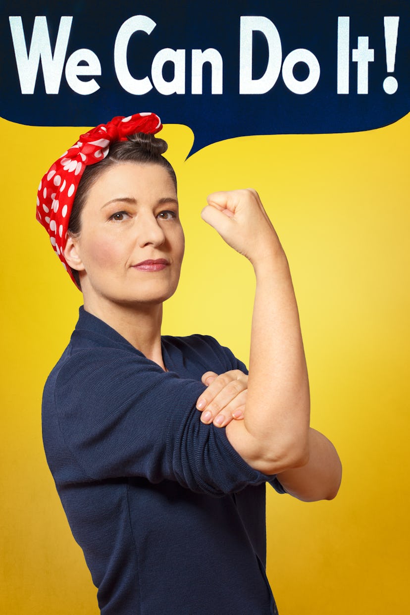Rosie the Riveter photo with text We can do it! A self-confident woman rolling up her sleeve, perfec...