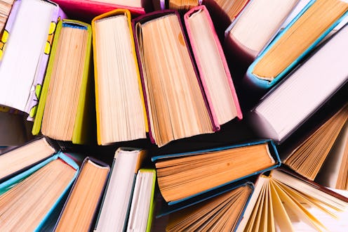 Top view of colorful hardback books in a circle. free copy space. Back to school copy space. Educati...