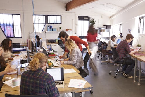 Interior Of Busy Design Office With Staff