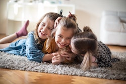  The greatest love is for the sister. Three little girls at home. 