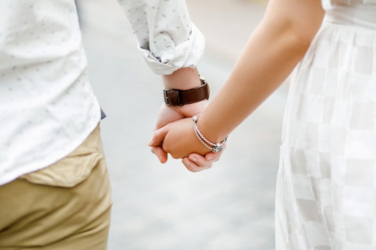 Hands of lovers on a walk