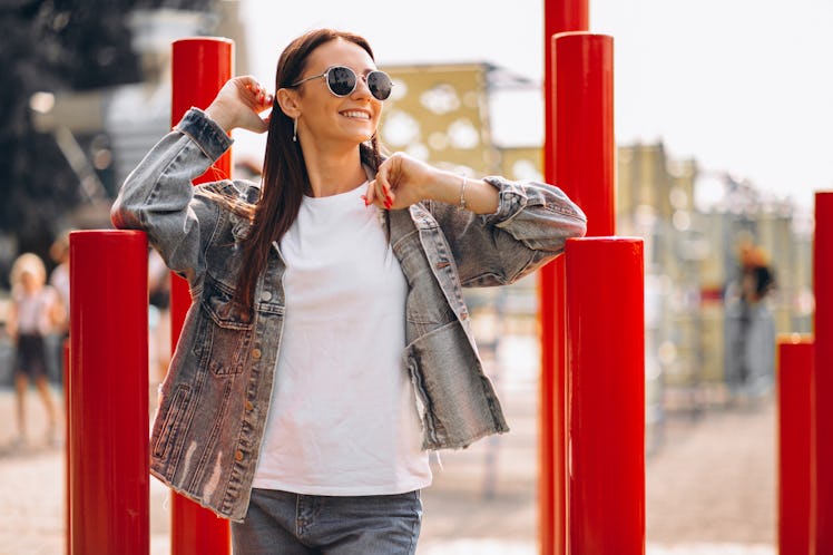 Portrait of a happy woman walking in park