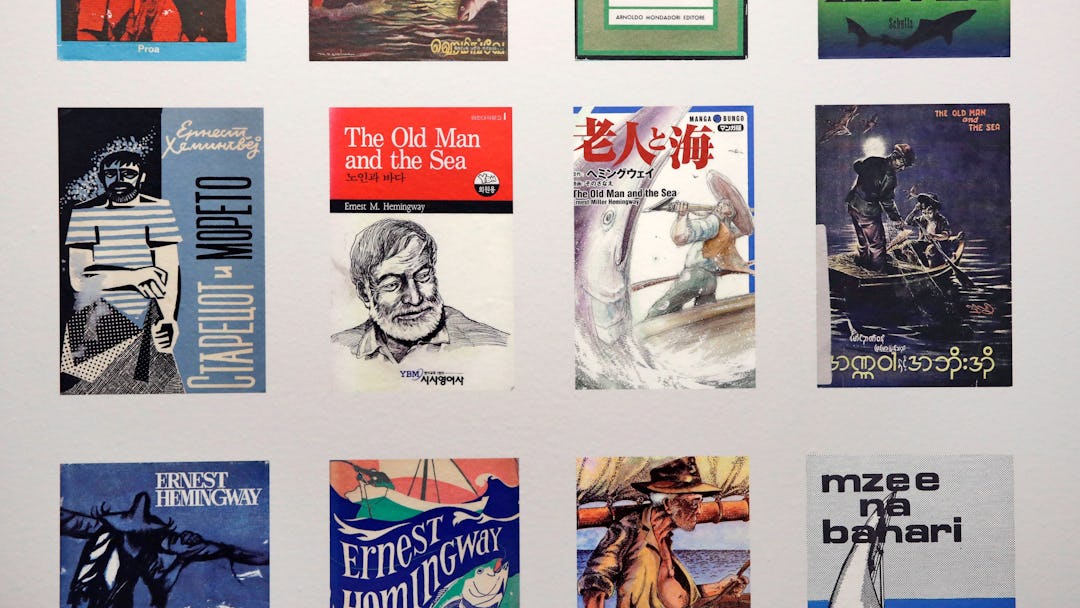 A selection of Ernest Hemingway's "The Old Man and the Sea" book covers are displayed in many langua...