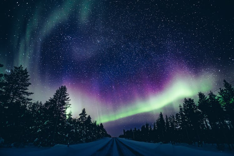 Colorful polar arctic Northern lights Aurora Borealis activity in winter Finland, Lapland