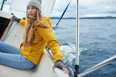 Young woman sailing the boat