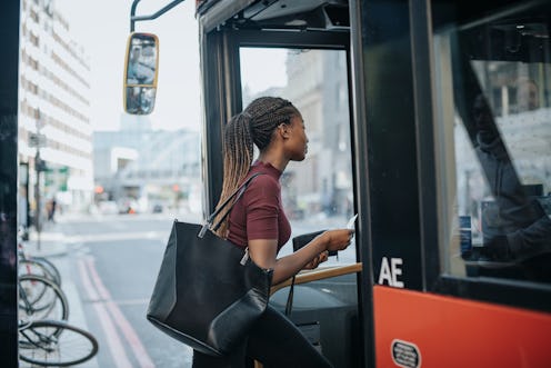 Woman getting on the bus