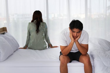 Unhappy Couple with problem relationship  appear on the bedroom background textures concept.