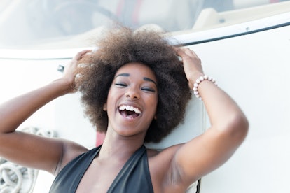 Attractive afro american girl on a yacht at summer day