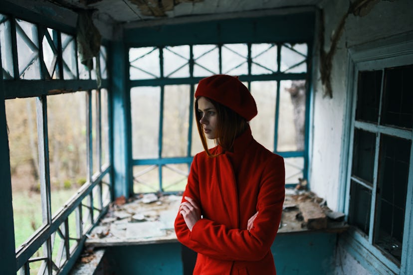    woman alone in an abandoned house                            