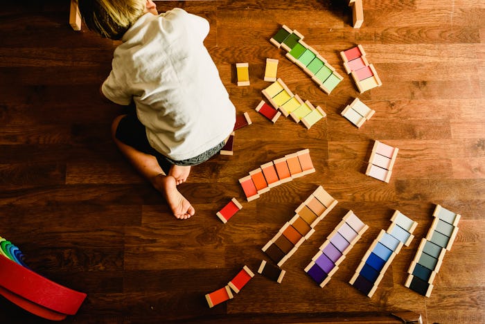 Children playing and learning with montessori color tablets