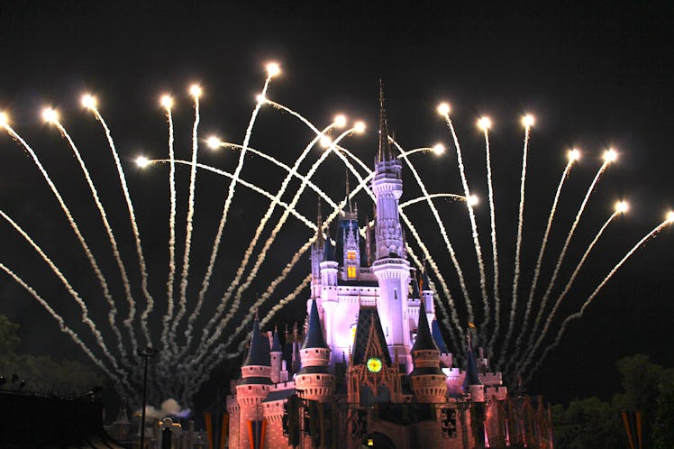 Disney's Cinderella castle at night during the fireworks show.