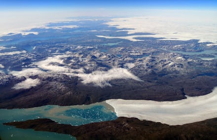 An aerial view shows the wild landscape, ice flows and glaciers of Greenland, seen through an airpla...