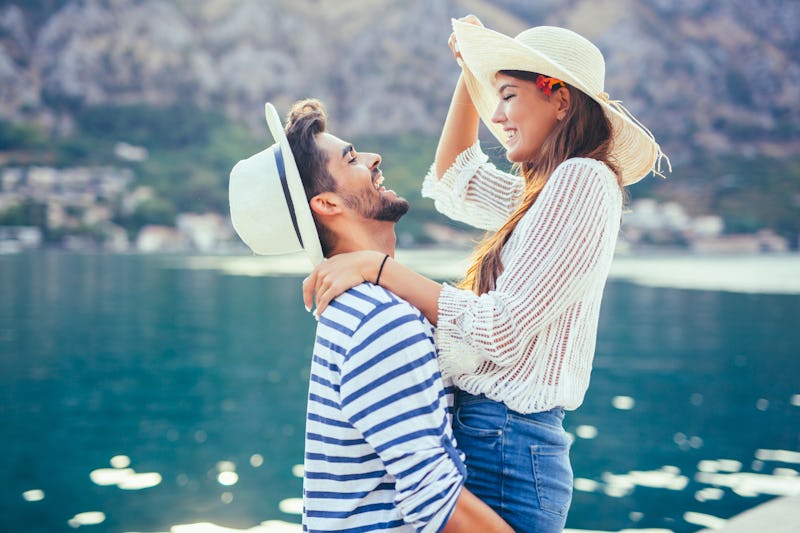 Couple in love, enjoying the summer time by the sea.