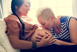 A pregnant lesbian woman and her partner. 