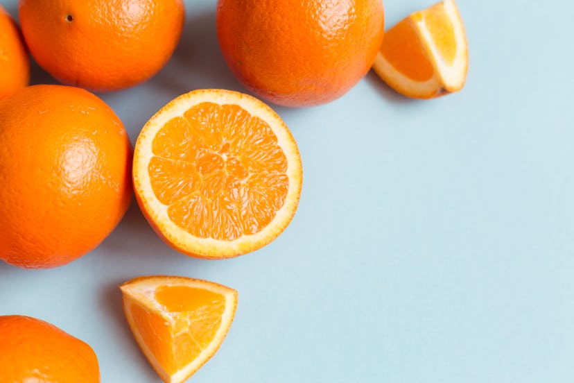 Fresh oranges on the blue background. Orange