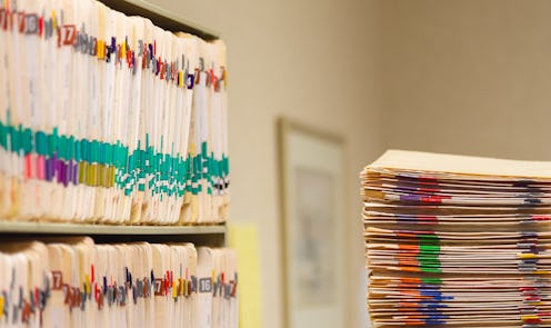 Medical Records folder archive organized in the file cabinet all in a row