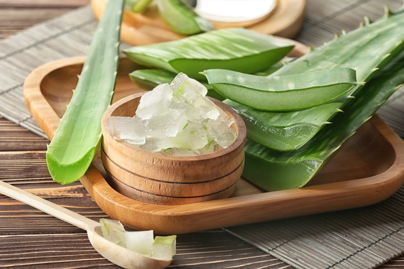 Bowl with aloe vera on wooden tray. Aloe vera is a great low-acid drink for acid reflux.