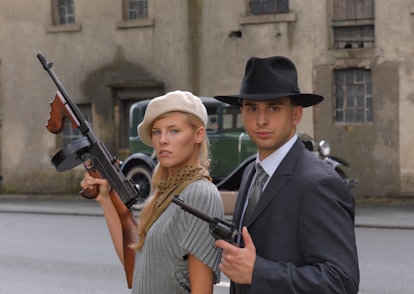 Two models get dressed up in 1930's style 
vintage fashion clothes and act the role of 
the gangster...