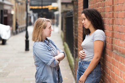 lesbian couple having a discussion in the street