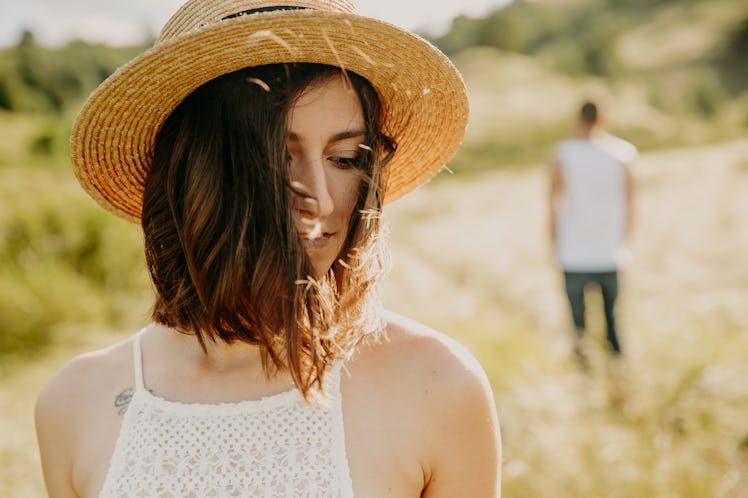 Frustrated young woman looking in distance, think about relationships, staying separately with man, ...