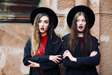 Surprise face, emotions, two best friends wearing stylish outfit, black hat, sunglasses, dress. Blog...