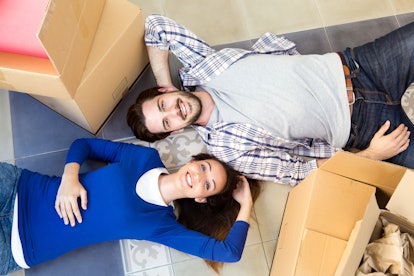 Portrait of Young couple moving in new home 