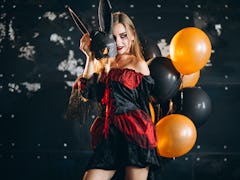 Woman in a halloween costume in studio