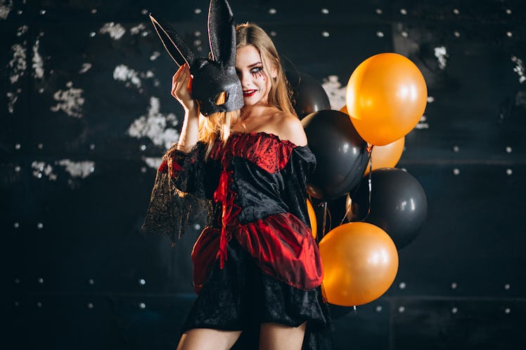 Woman in a halloween costume in studio