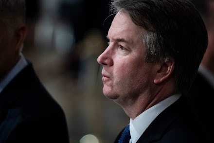 Supreme Court Associate Justice Brett M. Kavanaugh waits for the arrival of Former president George ...