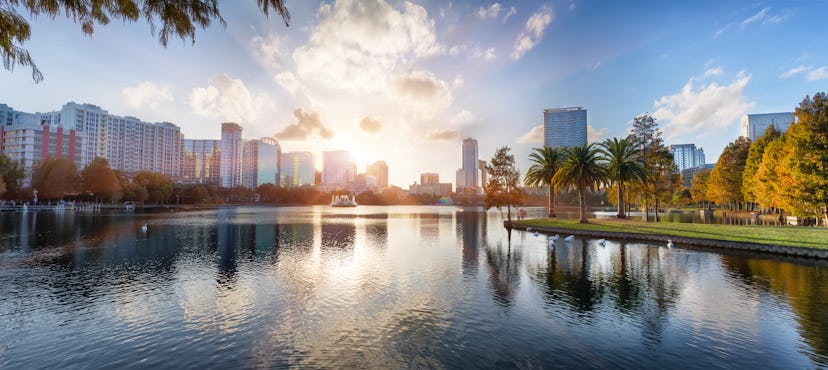 Sunset at Orlando in Lake Eola Park with water fountain and city skyline, Florida, USA