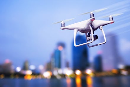 drone quad copter with high resolution digital camera on the sky