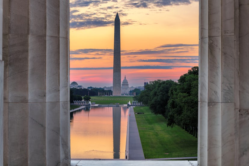 Sunrise at Washington, D.C. Washington Monument and Reflecting Pool at sunrise from Lincoln Memorial...