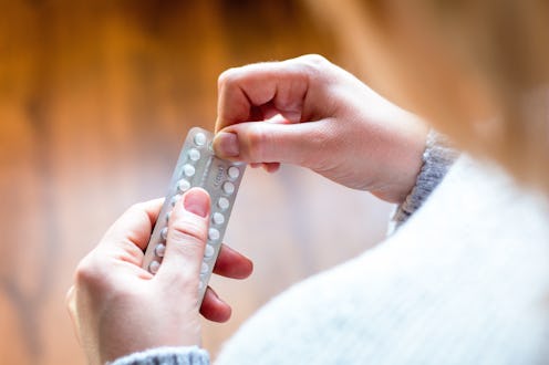 girl takes birth control pills