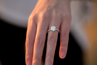 A newly engaged person shows off her ring. 