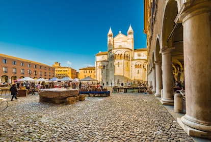 stalls of antique market in the main square of Modena in Italy