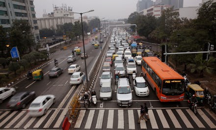 Traffic moves at dusk in New Delhi, India. When U.S. President Barack Obama visits New Delhi from Su...