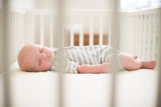 Baby sleeping in a crib