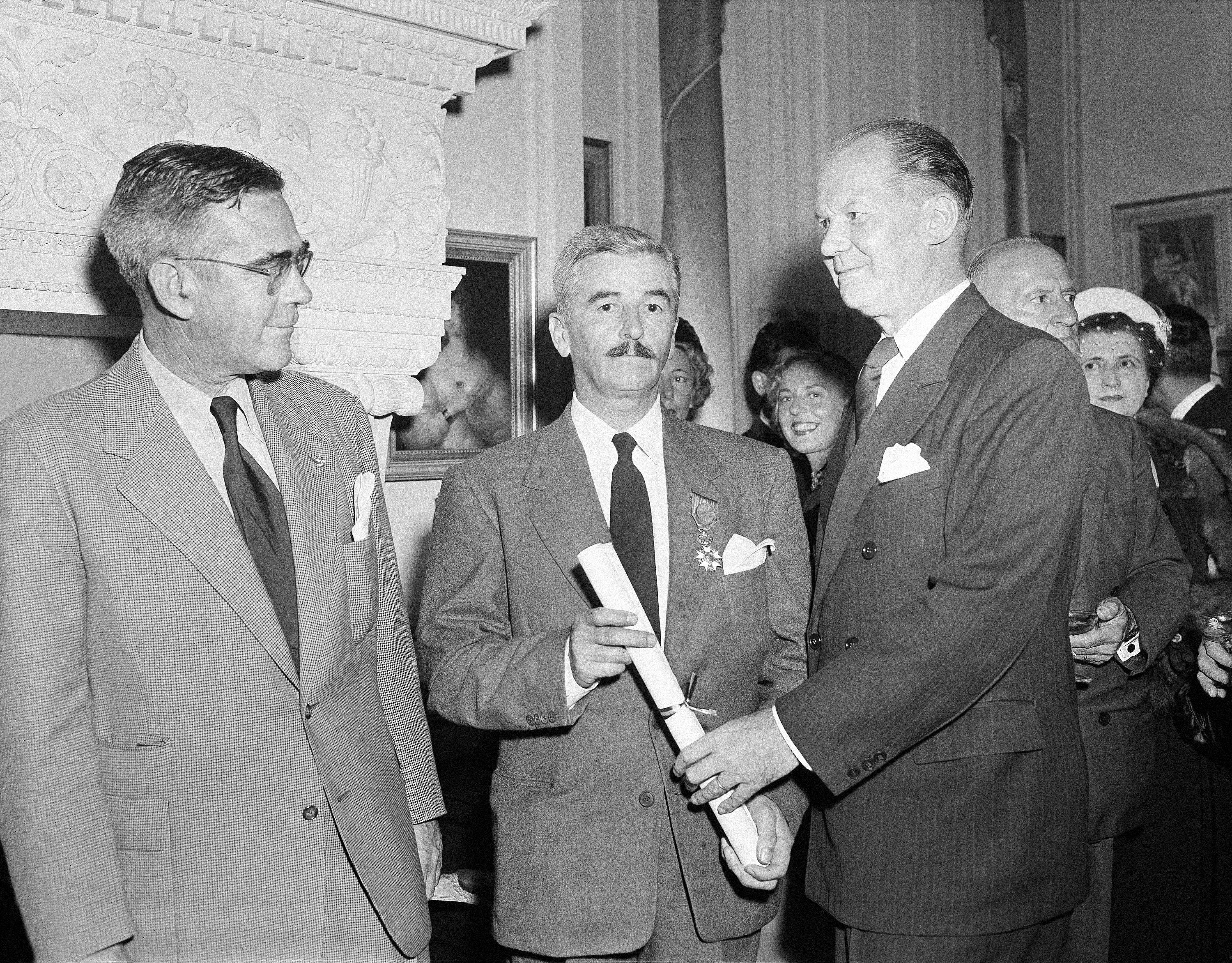 William Faulkner From left to right are F. G. Strachan, Censul of Sweden; William Faulkner, of Oxfor...
