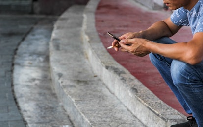 hands of smoking and using phone man
