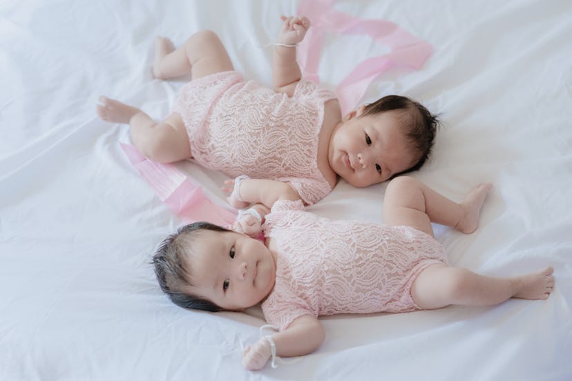 Twin babies on the bed