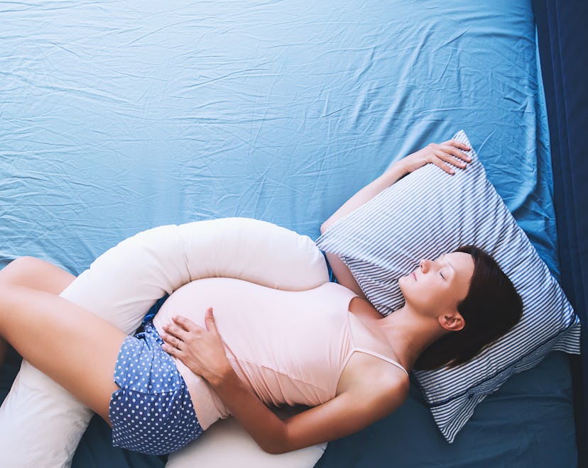 Beautiful pregnant woman relaxing or sleeping  in an article about can you go into labor while sleep...