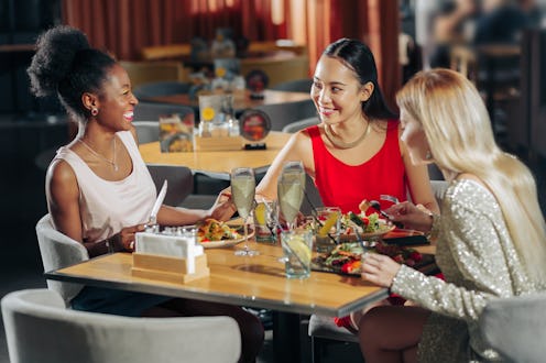 Woman laughing. African-American woman laughing while spending evening with friends