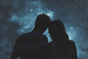Silhouettes of a young couple under the starry sky. Elements of this image are my work.
