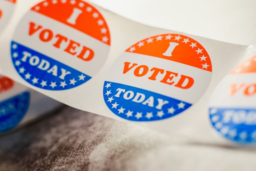 Roll of I voted circular stickers on a gray background for the November elections in the United Stat...