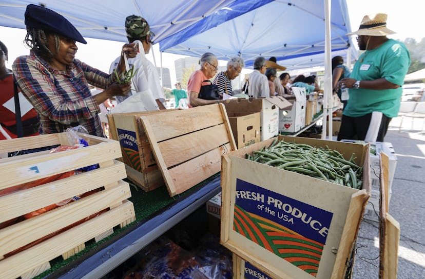 Residents Choose From a Variety of Fresh Vegetables During the Launch of the New Dekalb County Mobil...