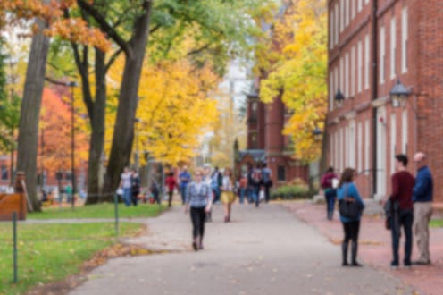Blurred background of a university campus on a beautiful Fall day.