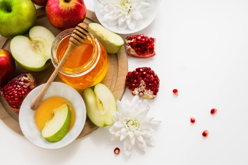 Apples, honey, pomegranate. Jewish New Year table set