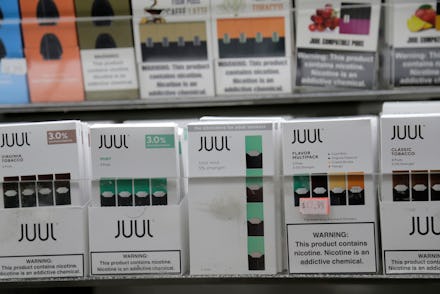 Juul products are displayed at a smoke shop in New York, . Altria, one of the world's biggest tobacc...